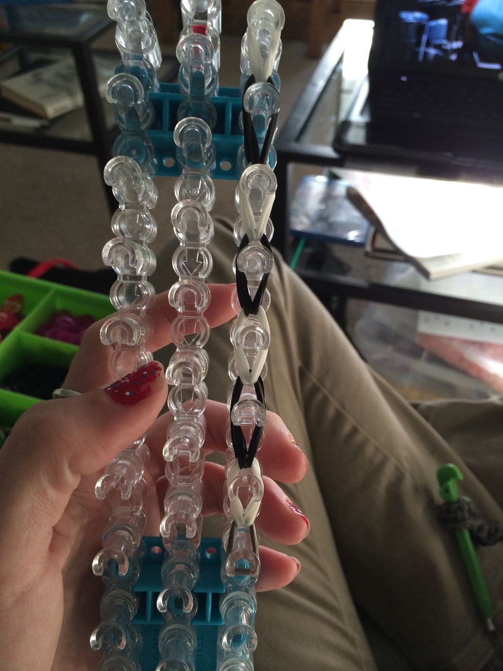 Continue your way up the loom. Pull the first leg off the loom.