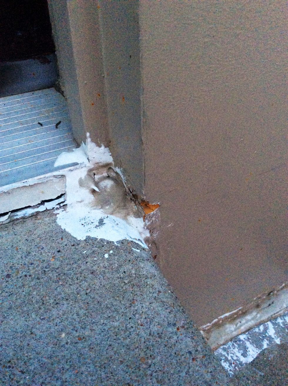 (Continued on) the water from the rain eroded it by pelting it with rain drops. This then makes the siding of the door fly off and move around throughout the wind.