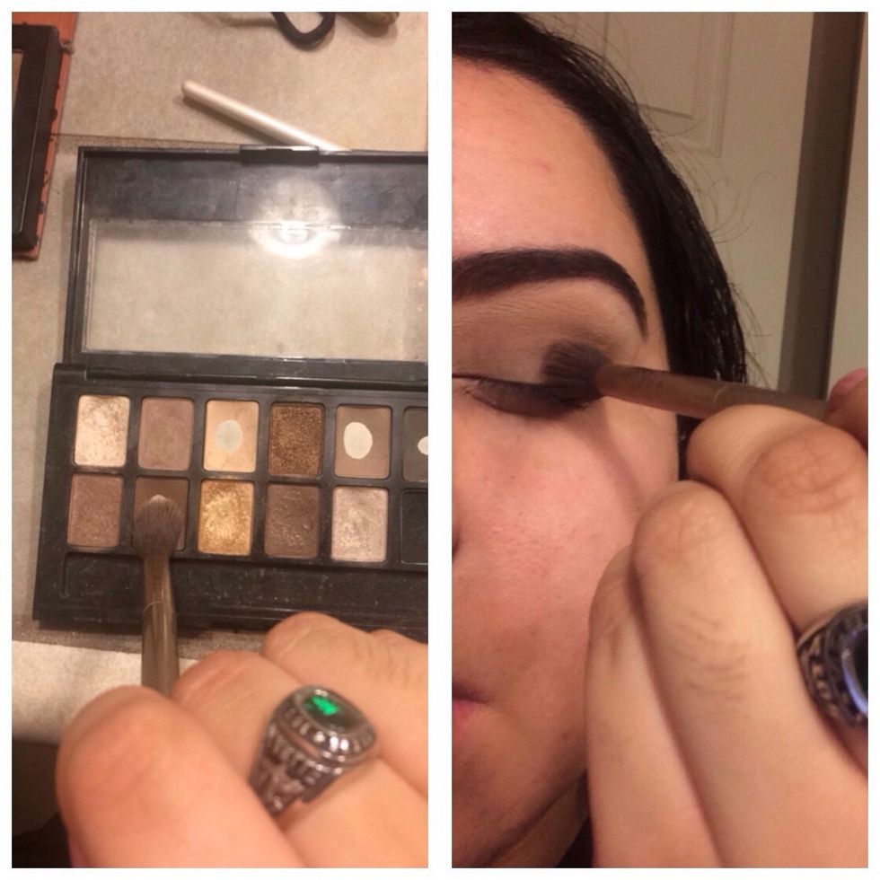 Continuing with the same fluffy brush, pick up a deeper and warmer chocolate brown shade and add this to your crease as well.