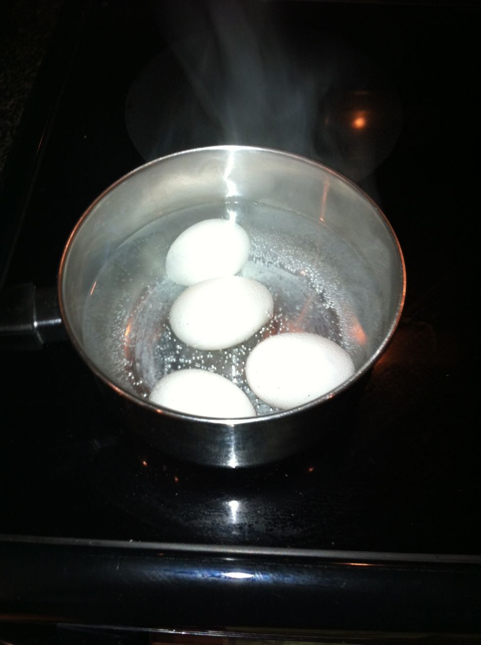 Cook 4 eggs for entire salad, the salad will make 4 big servings. Boil eggs rapidly for 12 minutes, when time is up dump hot water and allow cold water from sink to pour over them for 1 minute