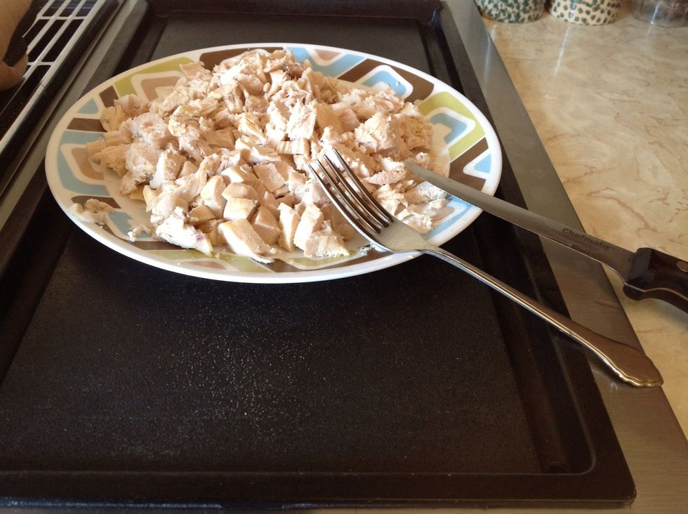 Cook and cut up chicken breasts.