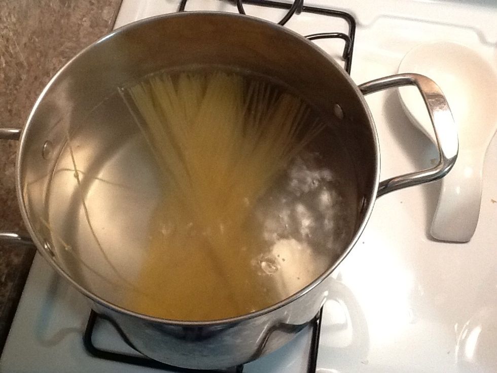 Cook and drain spaghetti.