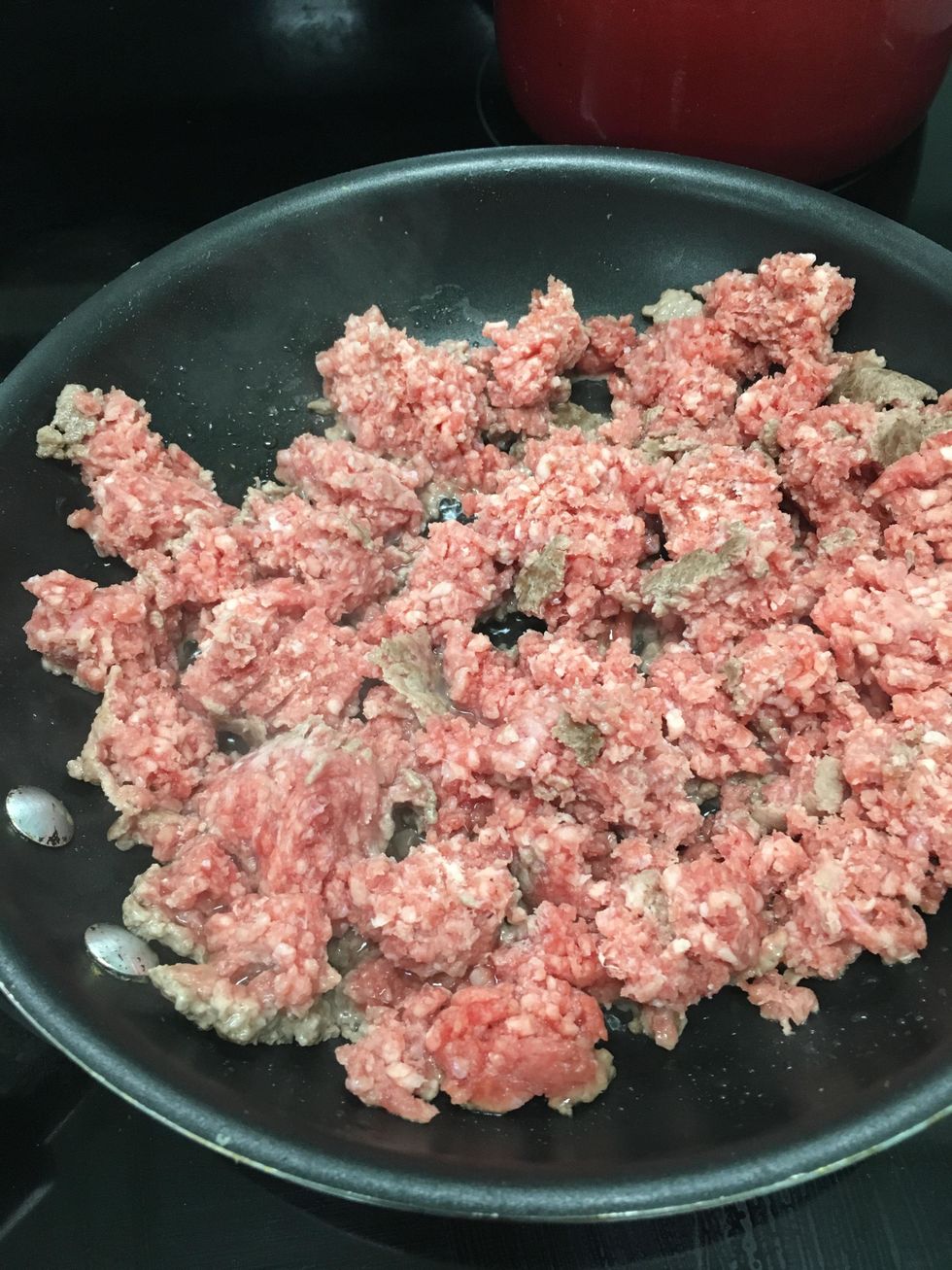 Cook and drain the ground beef.  Put steamer bag of broccoli in the microwave.