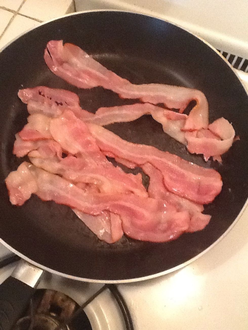 Cook bacon in a large skillet until almost crisp, about 4 minutes.
