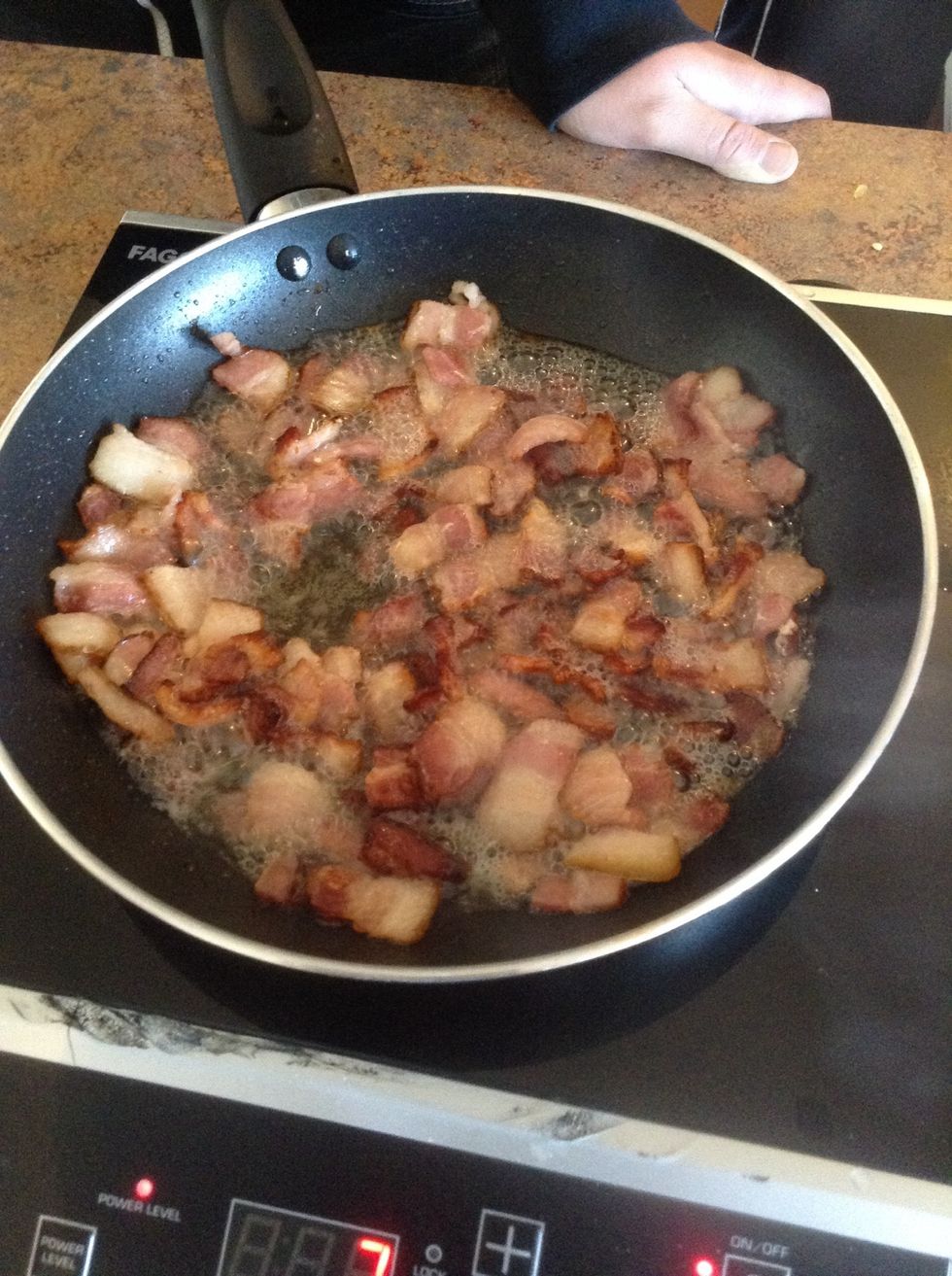 Cook bacon until the pieces are golden brown and slightly crispy