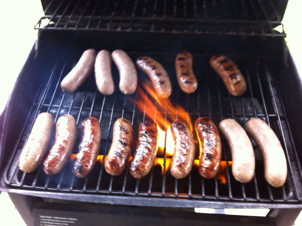 Cook brats to your liking. I prefer them to be a perfect mix of brown and black.