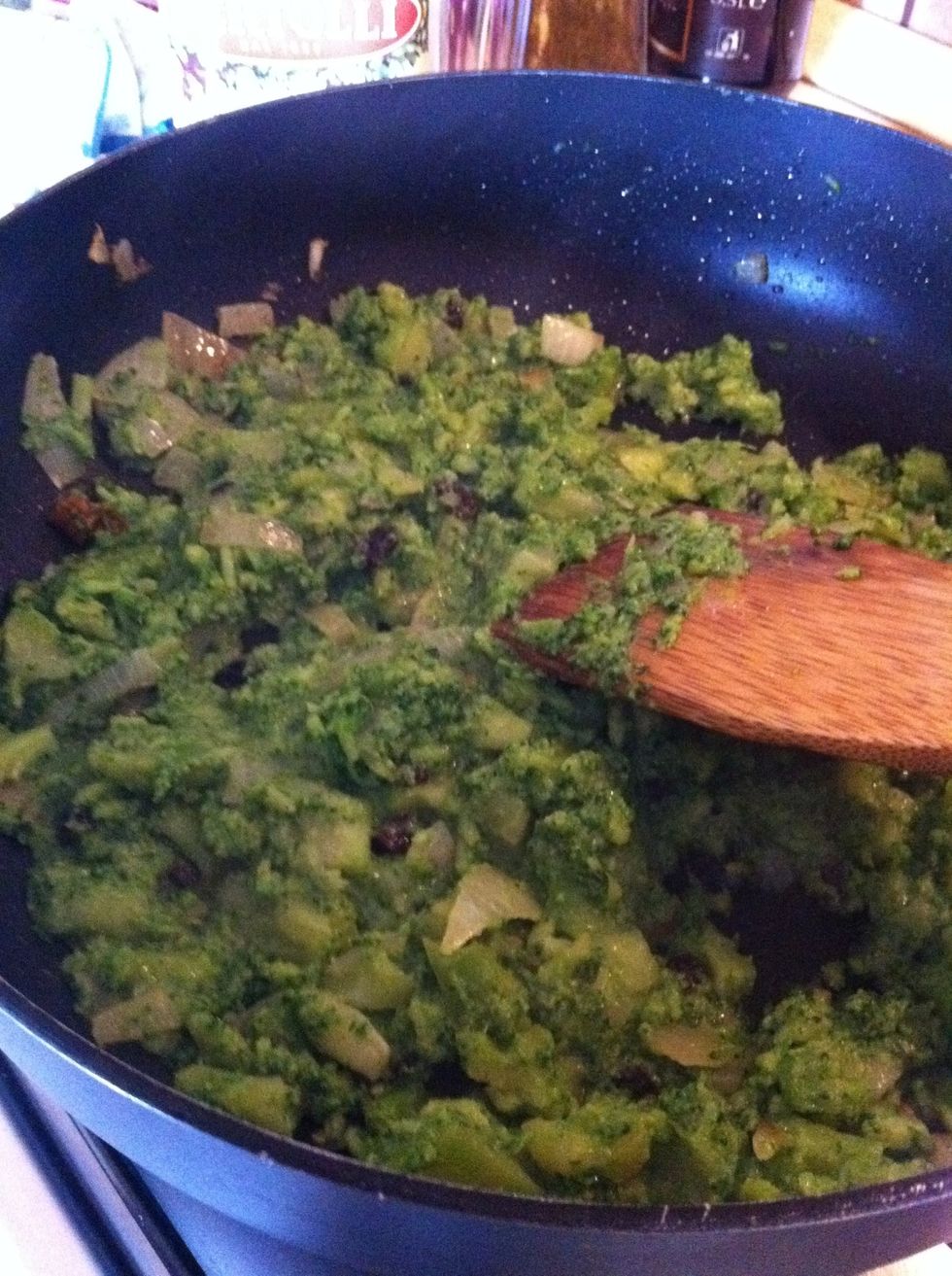 Cook broccoli with fried onions for 5 minutes mashing them until they reach a creamy texture.