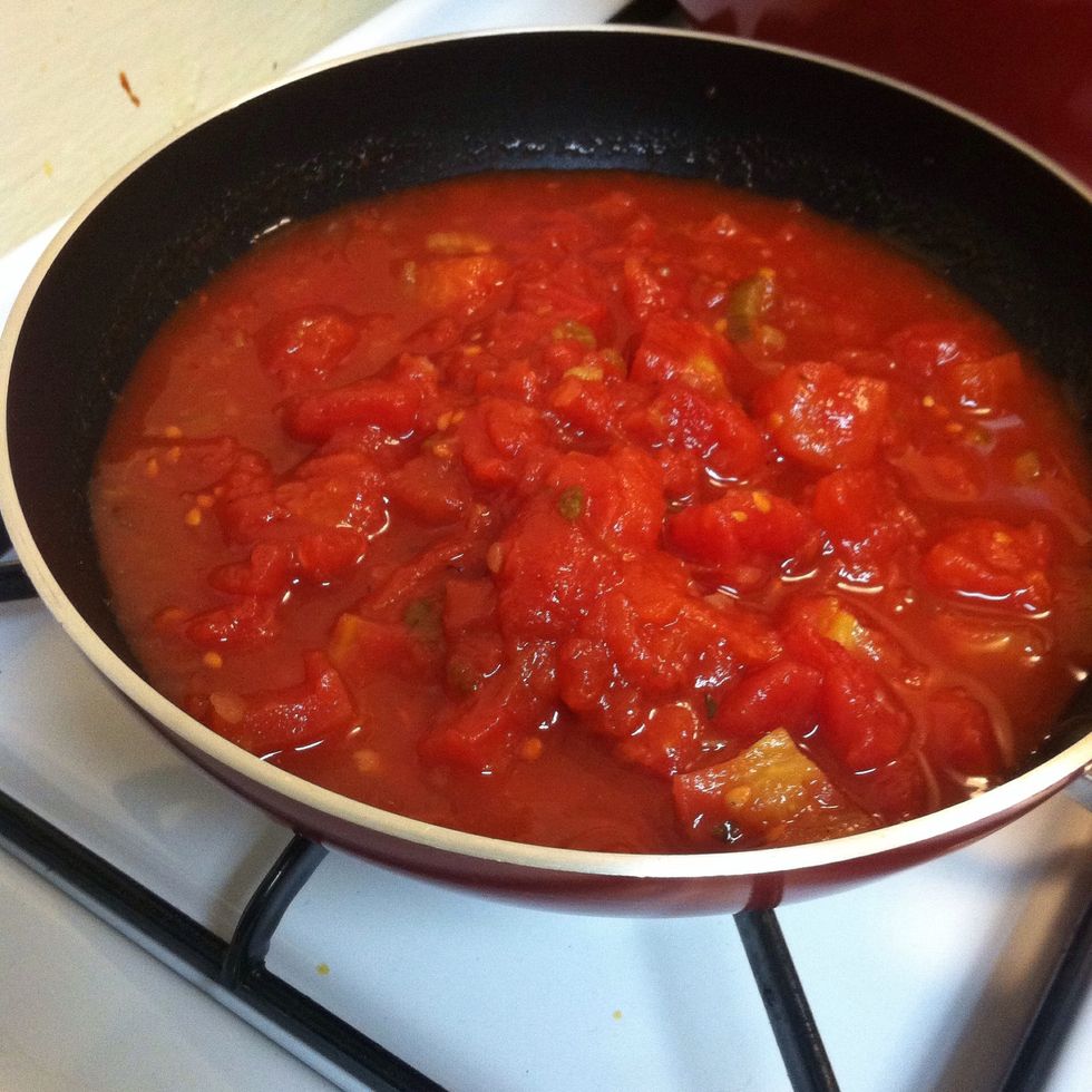 Cook can tomatoes.