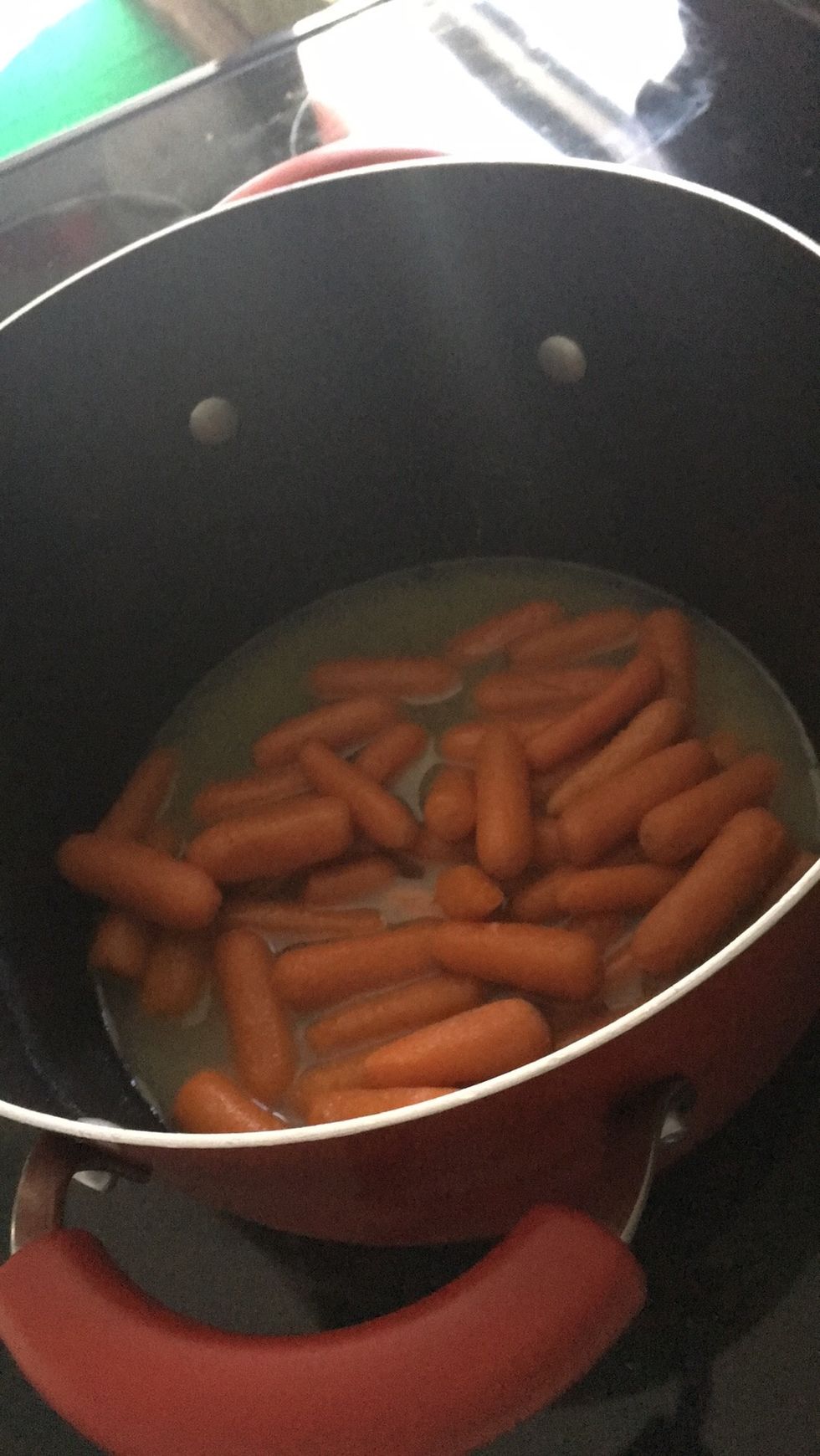 Cook carrots 7 or 8 minutes, remove lid, and raise heat to medium high. .