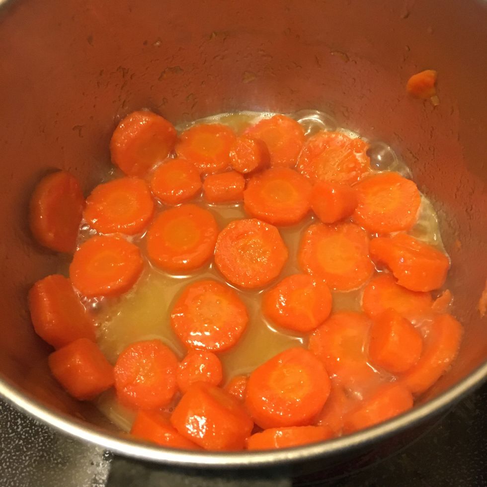 Cook carrots over medium heat in the glaze for 5 minutes, stirring often. Glaze should become a perfect consistency to coat the carrots and leave little to no liquid behind.