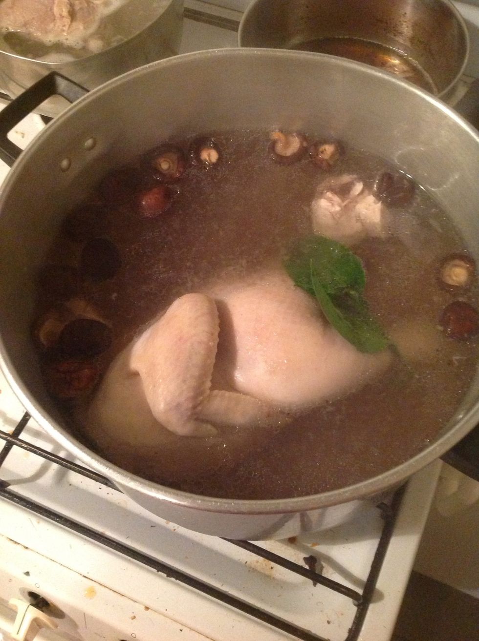 Cook chicken in cold water, boil it. Add grilled ginger, shallot, salt and sugar. If you like mushroom and lime leaf, put it in (traditional recipe does not contain those). It looks sexy right?! :)