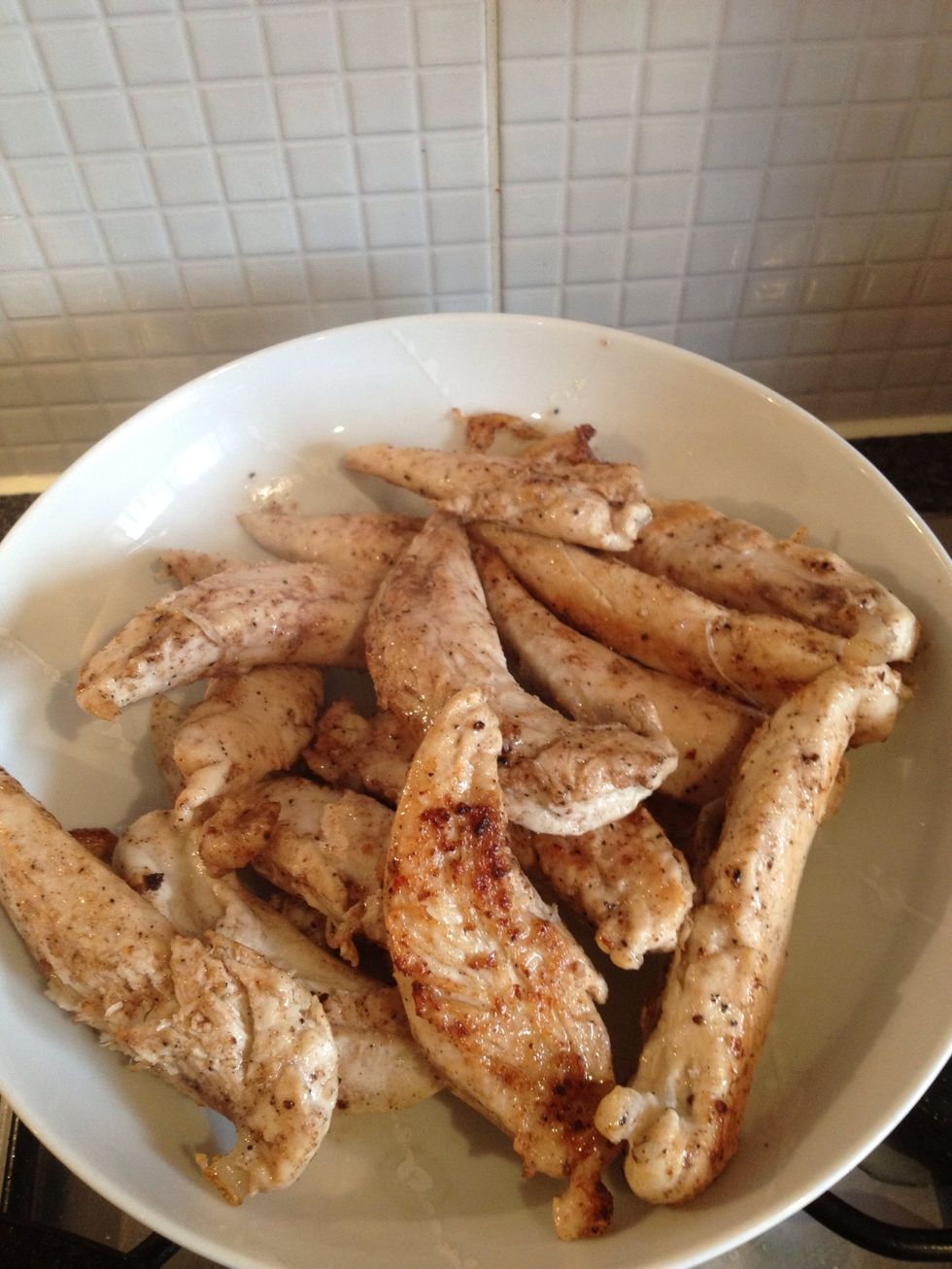 Cook chicken strips through thoroughly but don't over cook where the meat hardens, you want the chicken to remain soft and succulent. Then place the chicken in a bowl to one side.