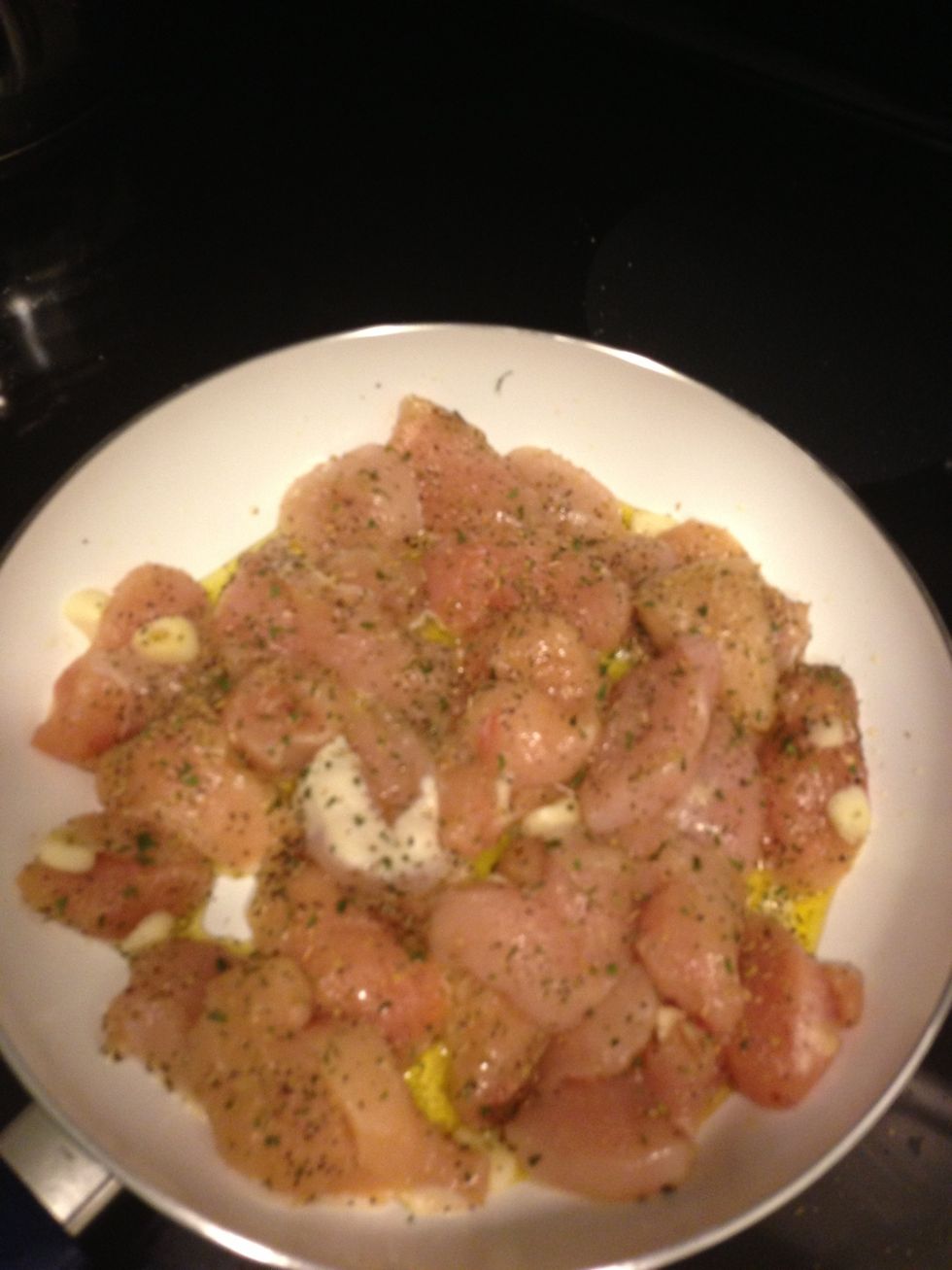 Cook chicken with spices from before and cook in oil on medium. Cook till their is no more pink in the center of the chicken and golden brown. Drain any liquid left over