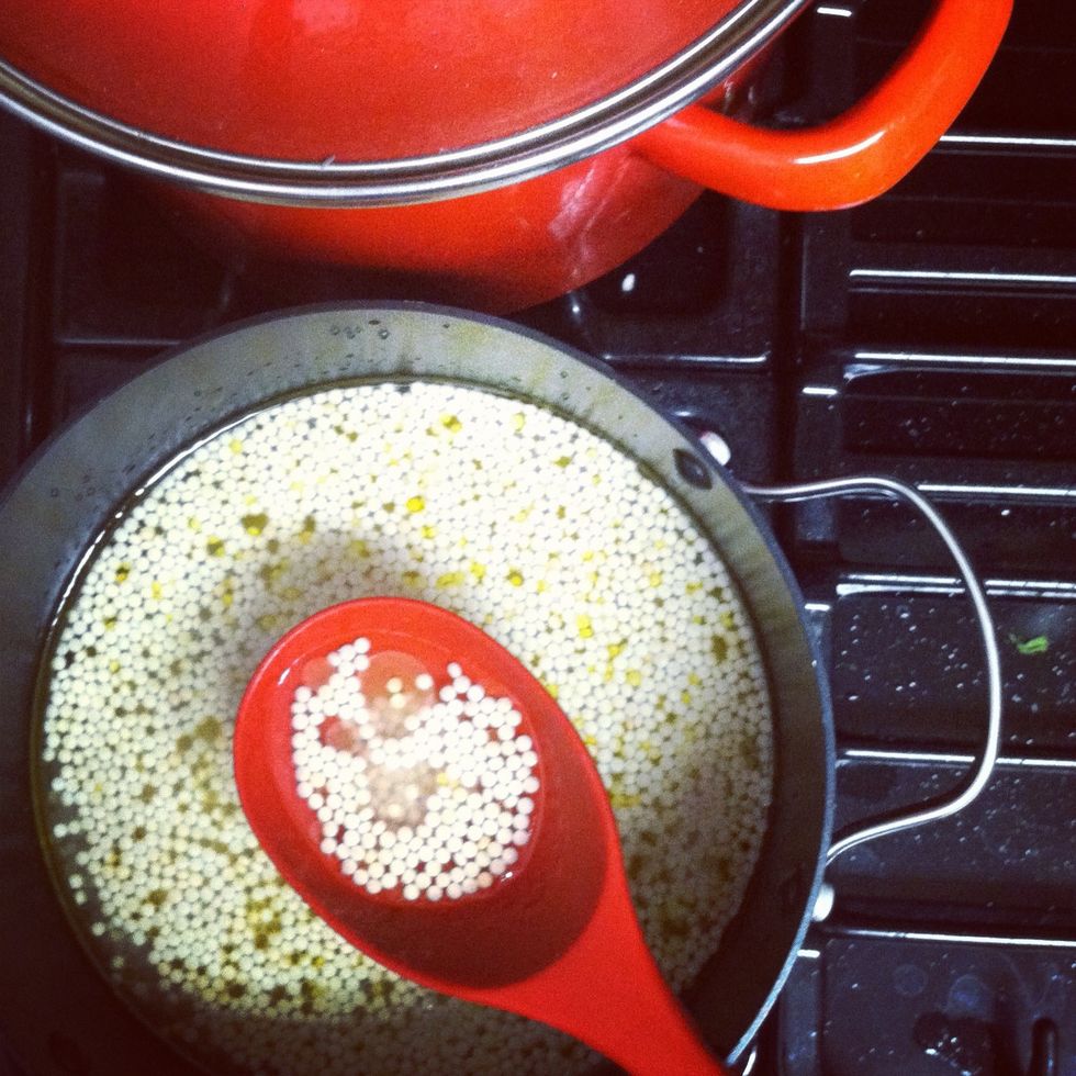 Cook couscous according to the package directions. Spread on a plate and let cool. Meanwhile, heat 1 tbsp. of the oil in a skillet over medium heat. Season chicken with 1/4 tsp. salt and pepper.