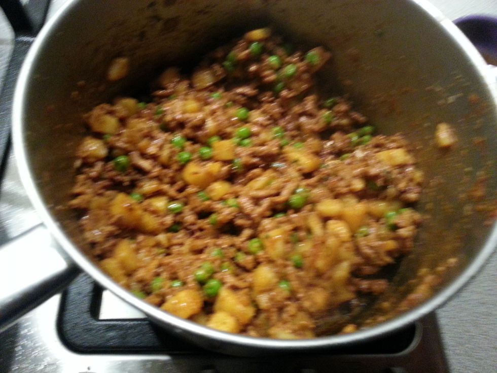 Cook for 8-10 minutes. Then add peas and cook for a further 2 minutes. If you like you may add 2 tbsp chopped fresh coriander leaves after cooking the filling. Allow this filling to cool.