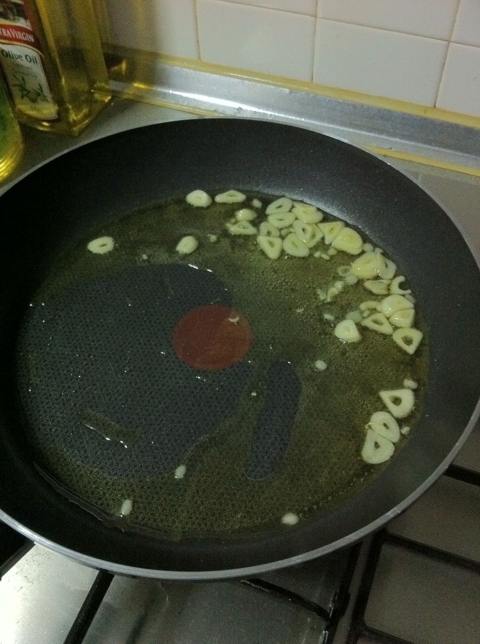 Cook for a bit and allow the oil to absorb the flavors. Cook until the garlic is golden brown.