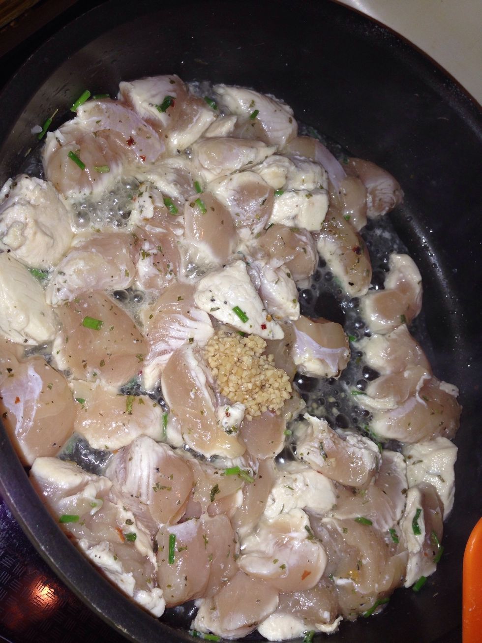Cook for a few min stir it a lot and then add in some chives and some garlic keep stirring