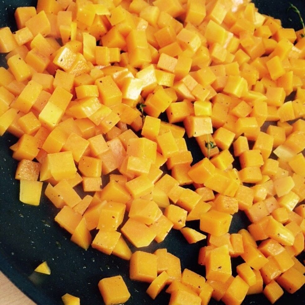 Cook for another 10-15 minutes over medium heat, saut\u00e9ing it regularly. Add more water as it evaporates. Cook more or less according to how soft you want the butternut squash.