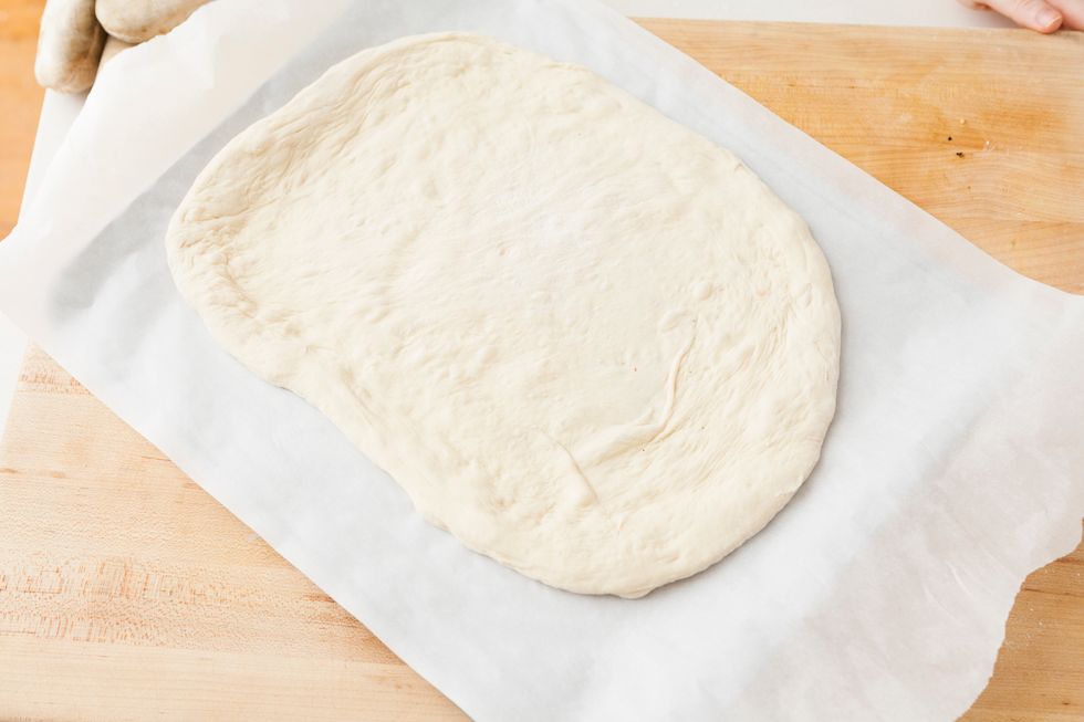 Cook formed pizza crust for 5-10 minutes. Slightly pre-cooking the crust will help it hold all of its delicious and heavy toppings.