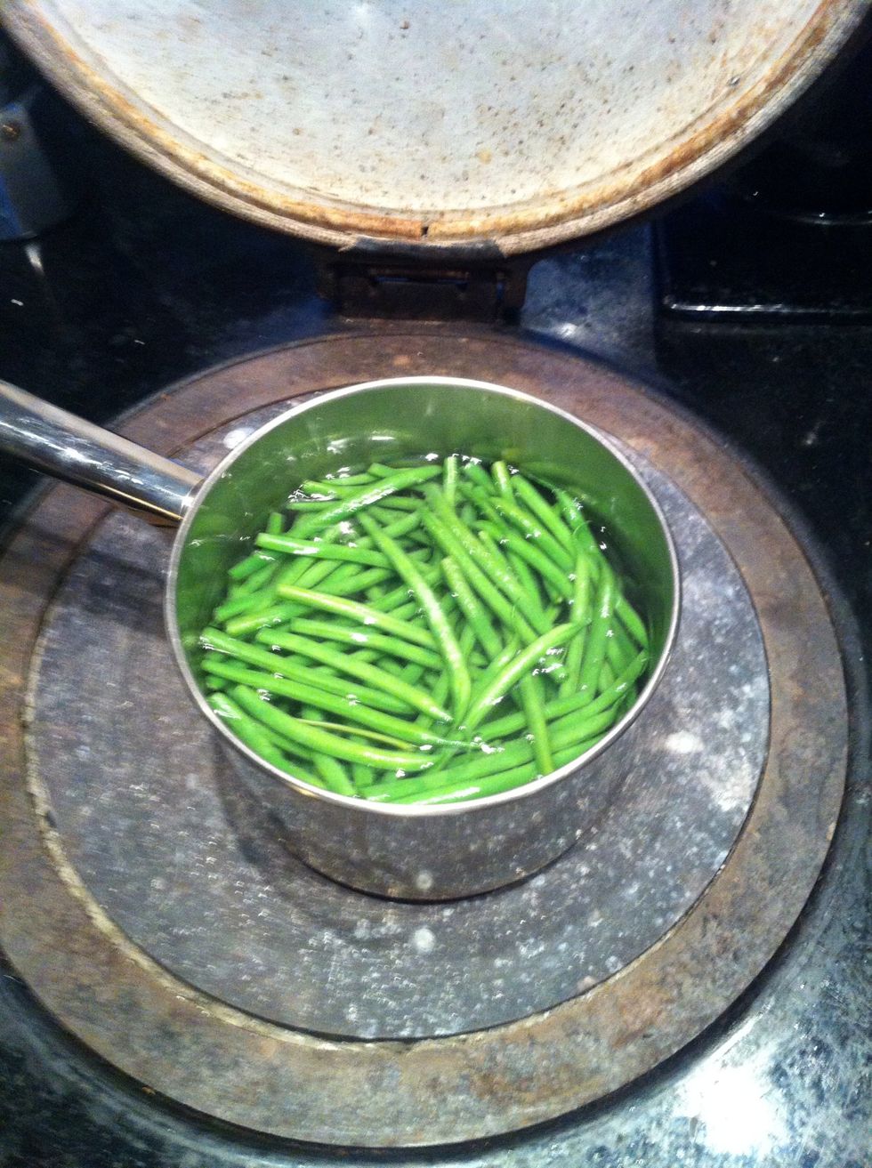 Cook green been with bit of salt