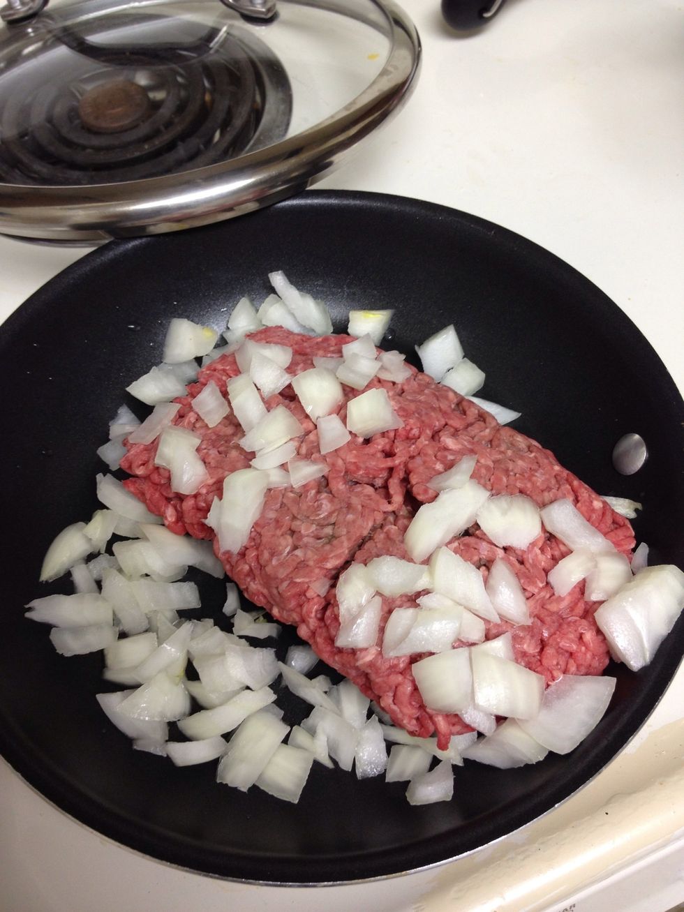 Cook ground beef and onion over medium.
