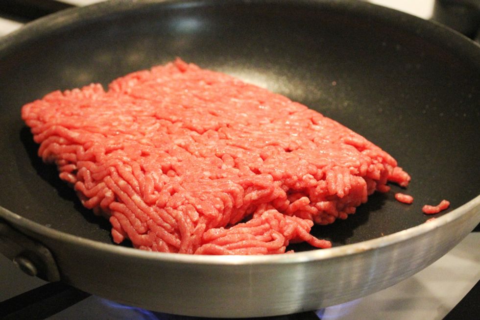 Cook ground beef until brown drain grease, Then, add seasonings and tomato sauce