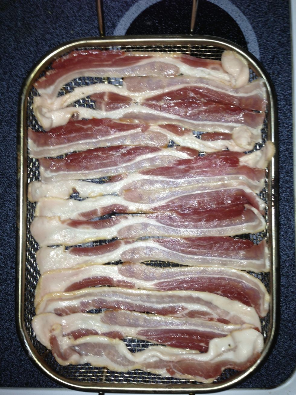 Cook half a pound of bacon. This is one pound here because I'm making 2 at a time.  I prefer to make bacon in the oven so I use a grill rack and spread the bacon out on it.  Preheat oven to 425 f.