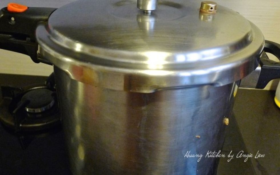 Cook in pressure cooker until done. Alternatively, allow all the ingredients with the gravy including the sea cucumber to simmer in a pot for 45 minutes over medium-low heat or until cooked.