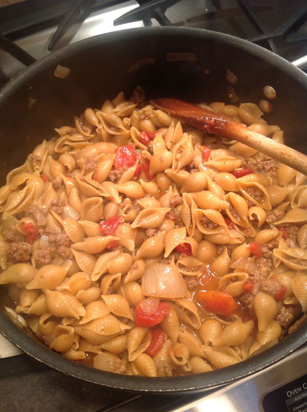 Cook on high heat and boil until pasta is cooked and liquid has evaporated.