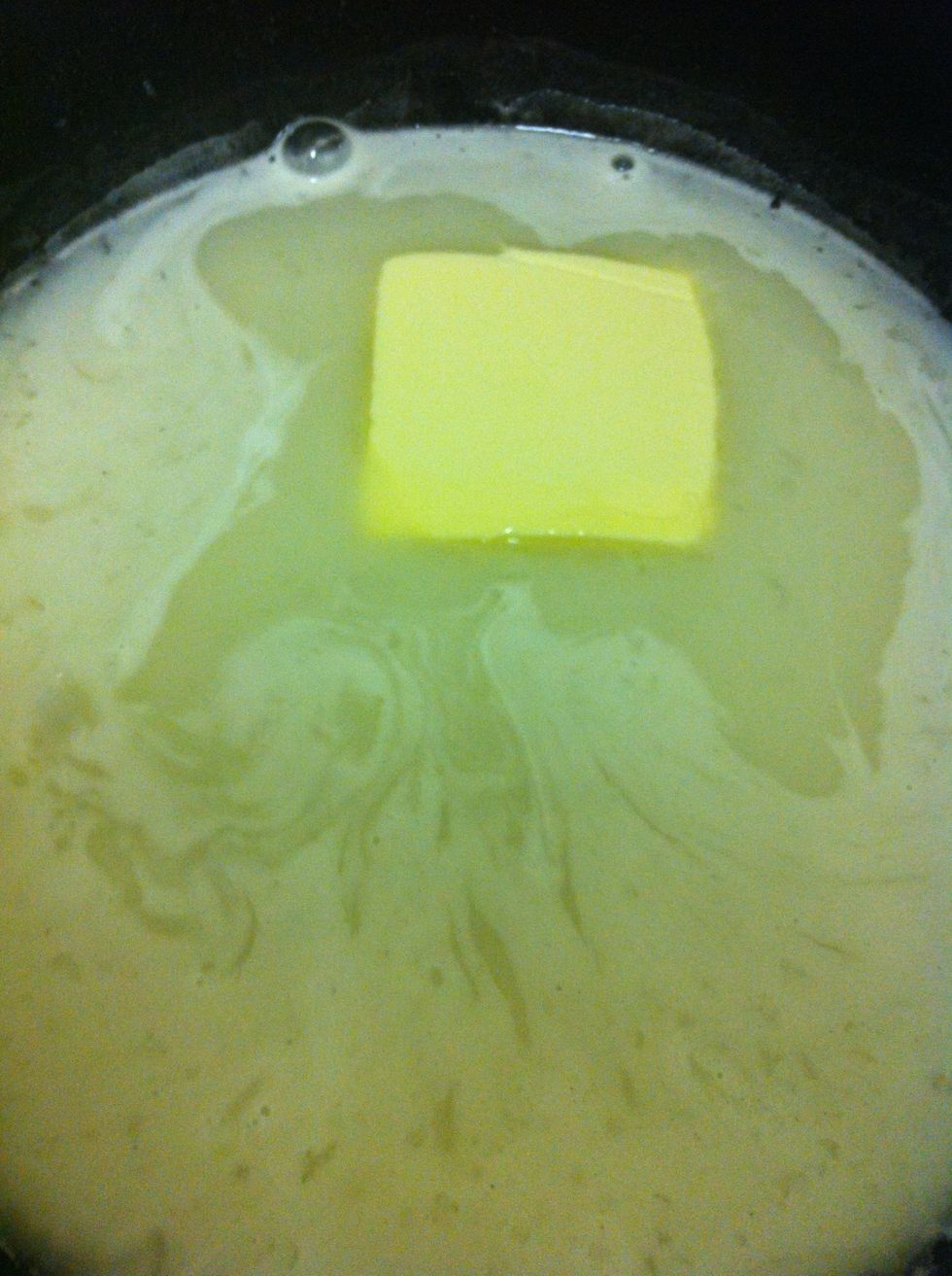 Cook on medium heat until mixture starts to boil while whisking constantly. Add butter.