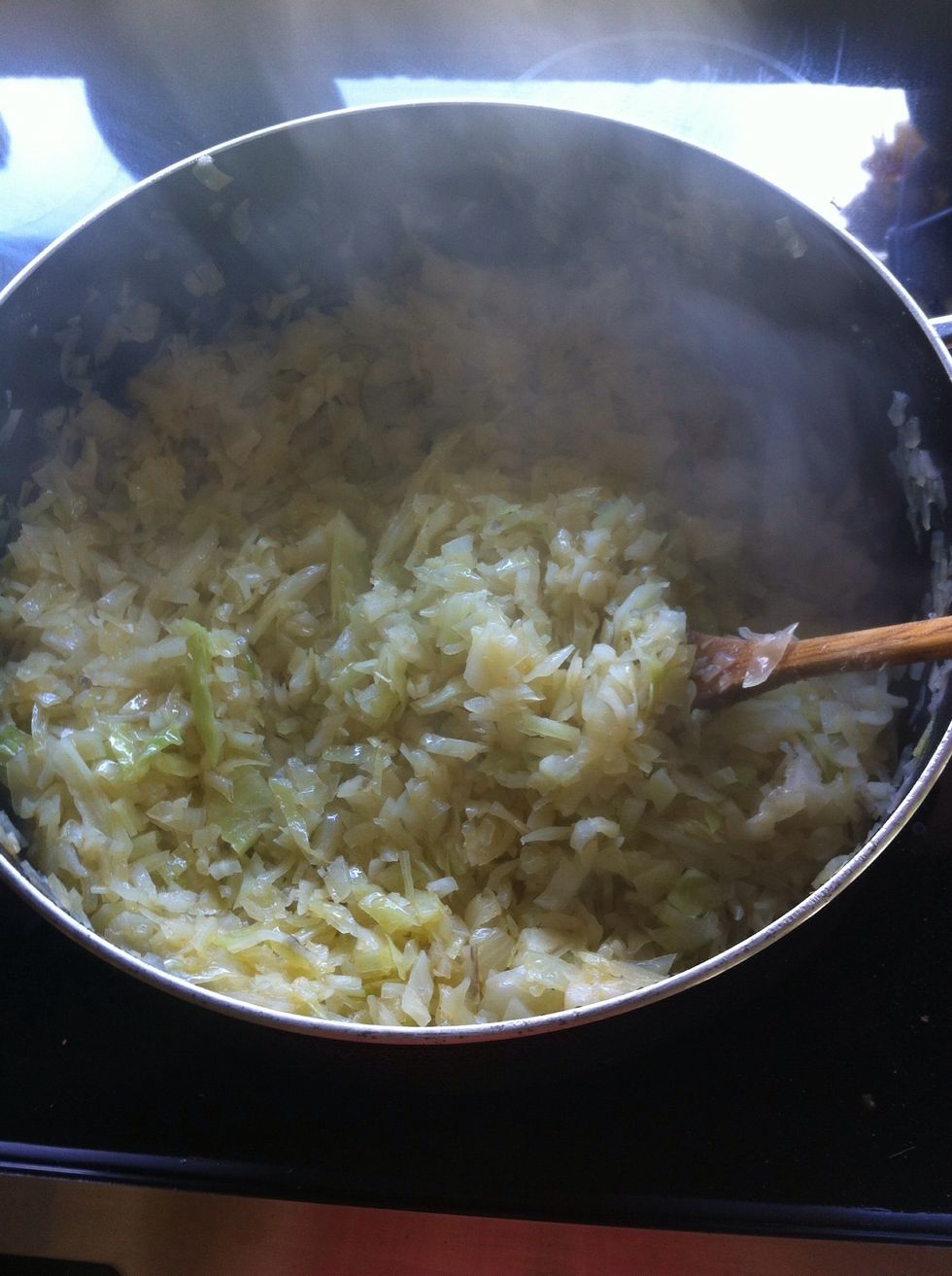 Cook onions and cabbage with salt to taste and paprika to taste until transparent.