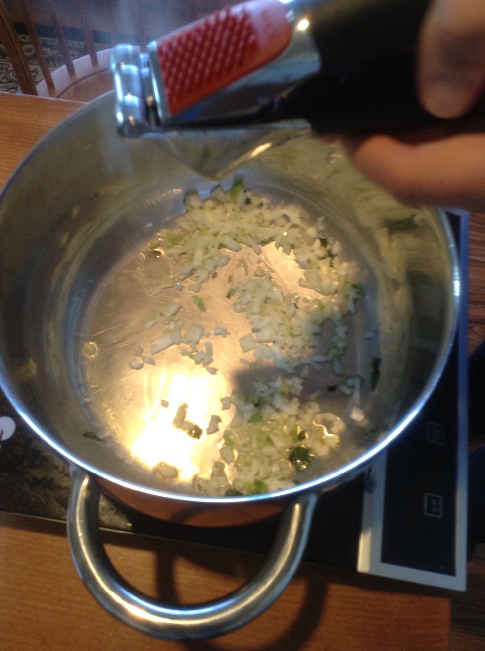 Cook onions and garlic until the onions are soft.