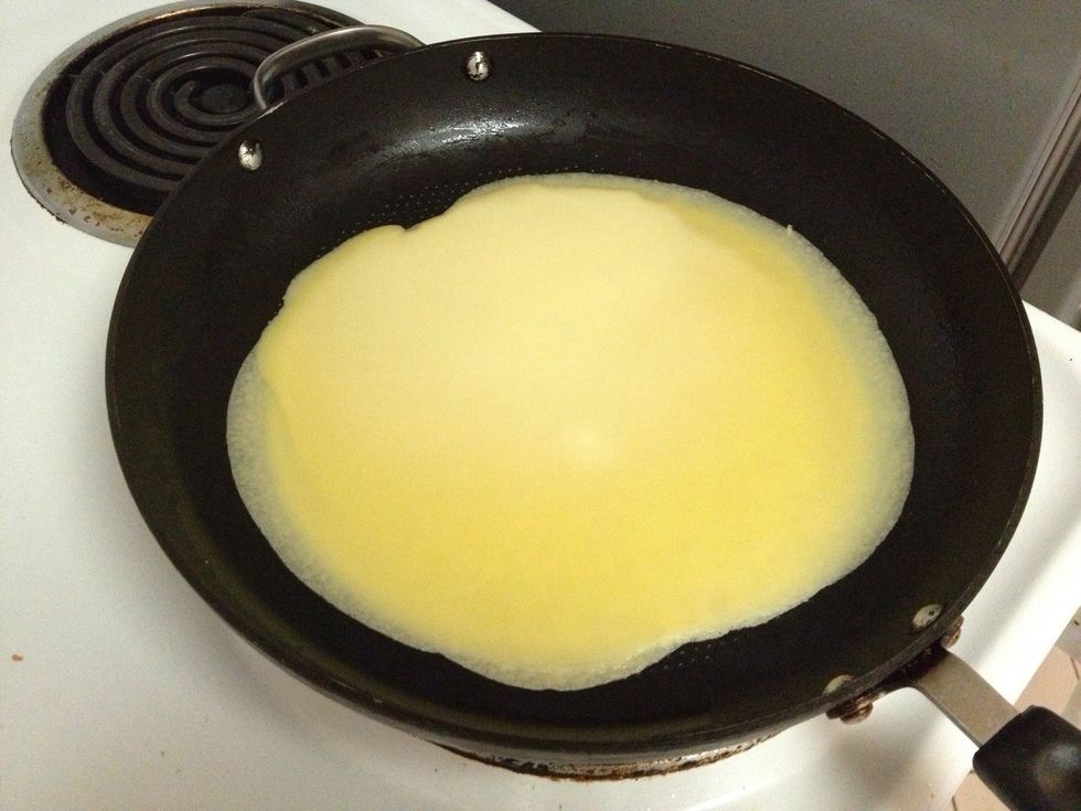 Cook our crepe mixture for a minute on each side.