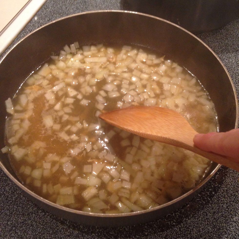 Cook over medium heat, scraping the bottom of the pan to add flavor to the onions.