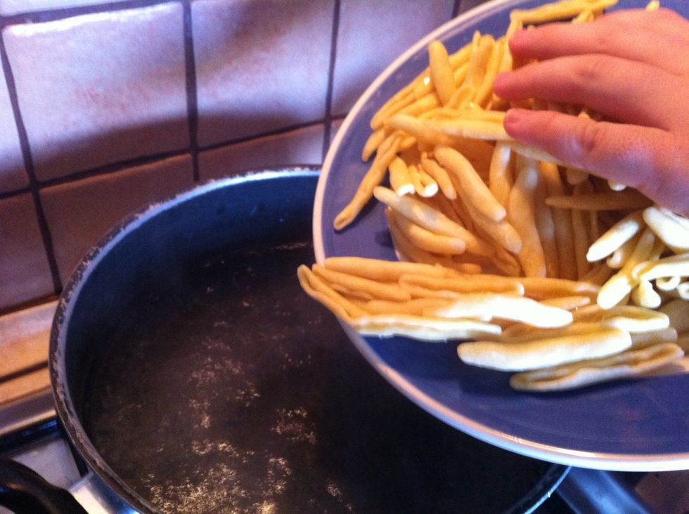 Cook pasta in salty boiling water until it's "al dente"
