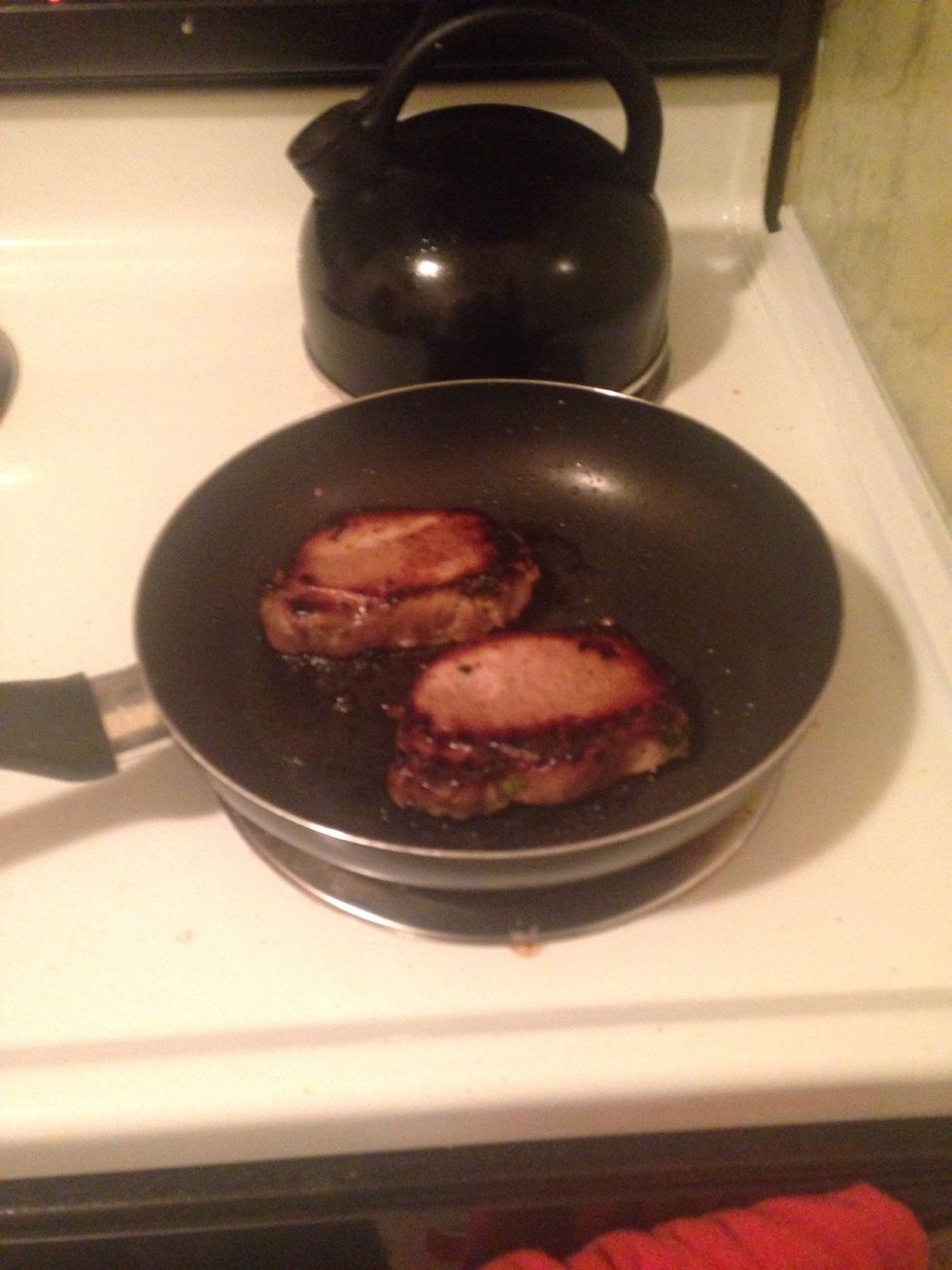 Cook pork chops on each side for about 4 minutes.