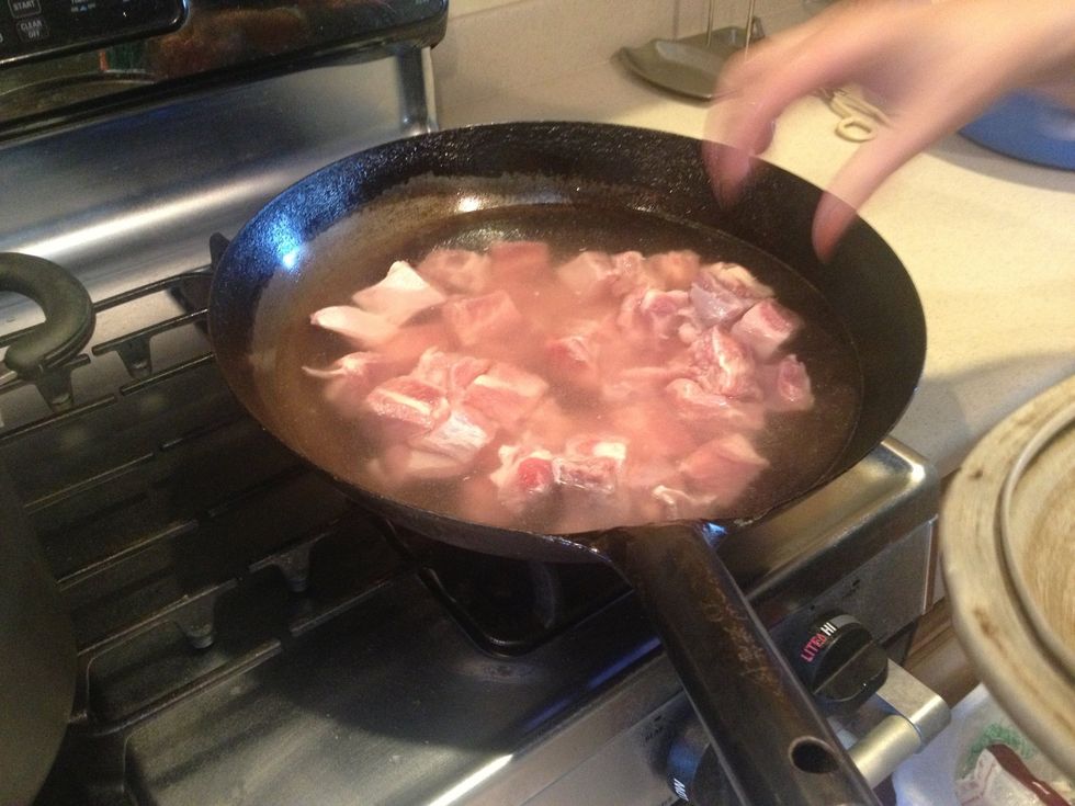 Cook ribs to remove blood and whatever it is