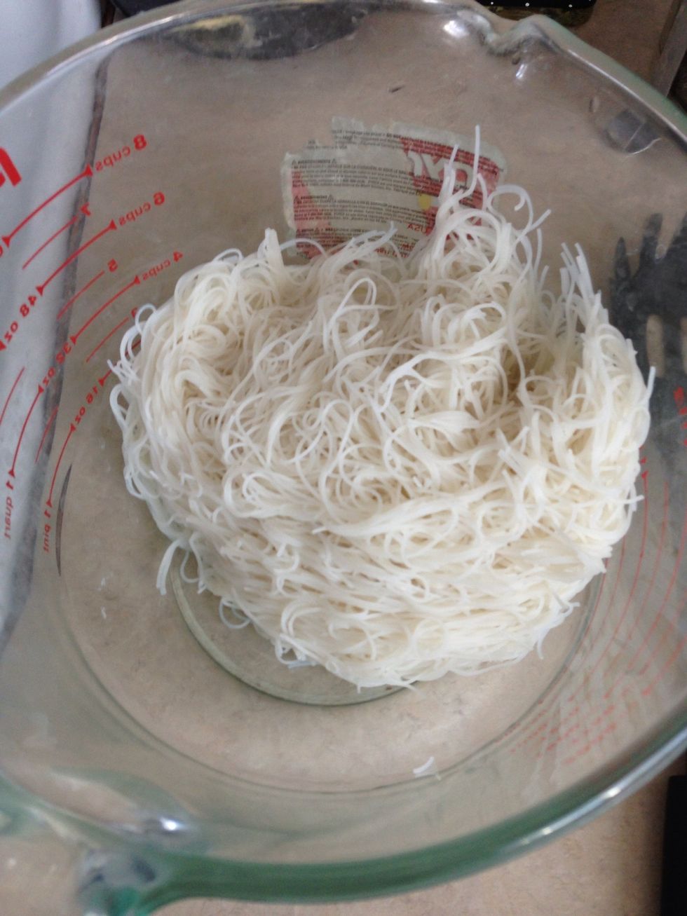 Cook rice vermicelli in hot water until just soft. Drain and rinse with cold water. Set aside.