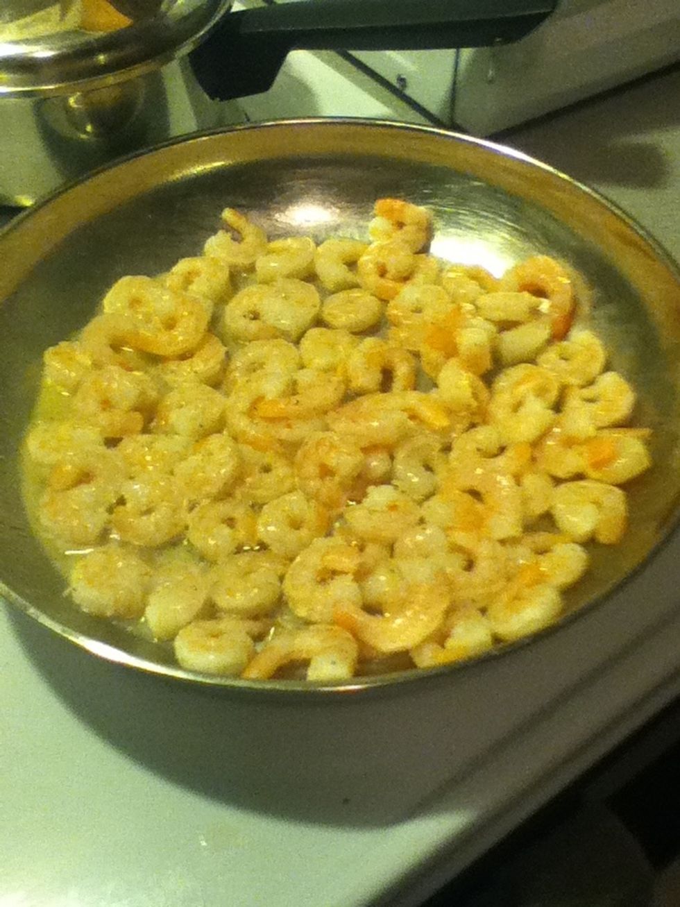 Cook shrimp in large skillet with butter or olive oil.