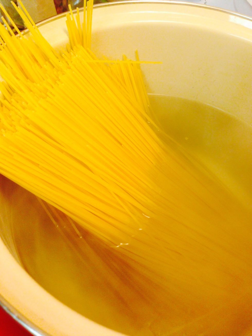 Cook spaghetti according to package directions
