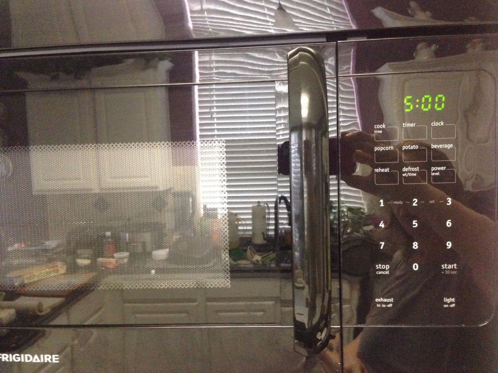 Cook spinach in microwave for 5 minutes on High.