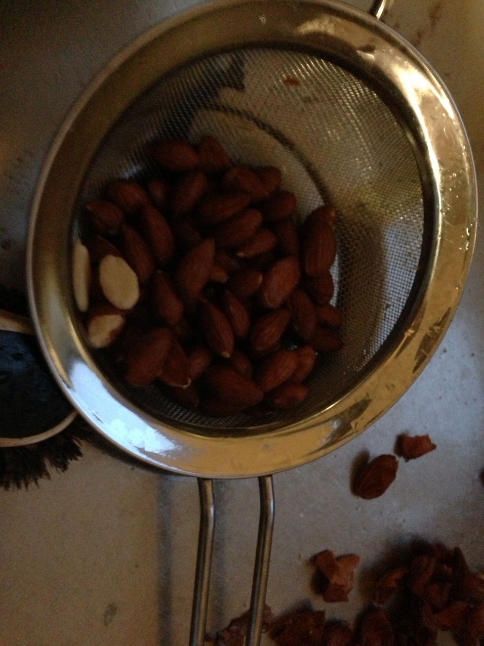 Cook the almonds, and rinse with cold water