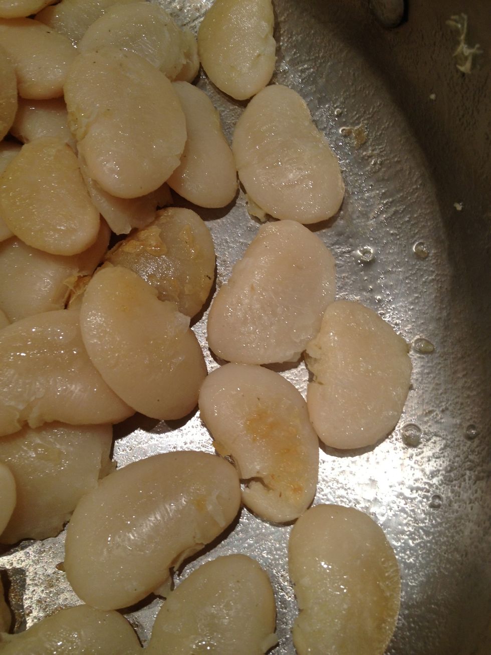 Cook the beans for about 5 minutes until they get golden. Flip them to the other side, and cook another 5 minutes or so, until they are golden on both sides.