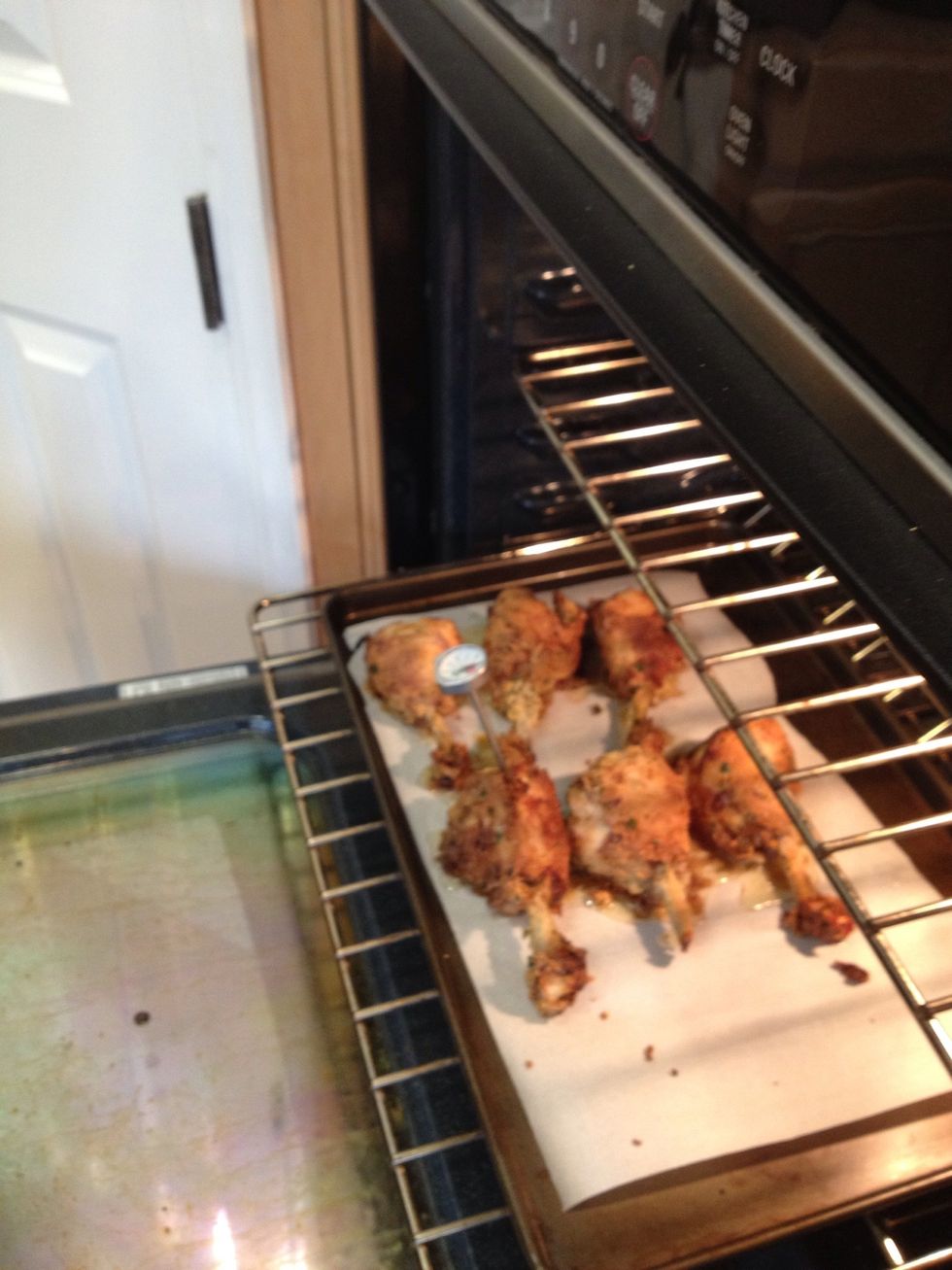 Cook the chicken in the oven for about 30 minutes or until it is done. You can check the temperature with a meat thermometer to be sure it's cooked through. Look for it to be around 180.