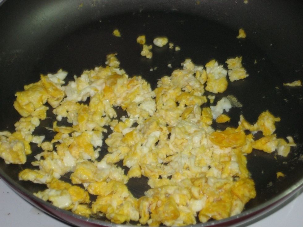 Cook the eggs in advance on separate pan but leave slightly runny