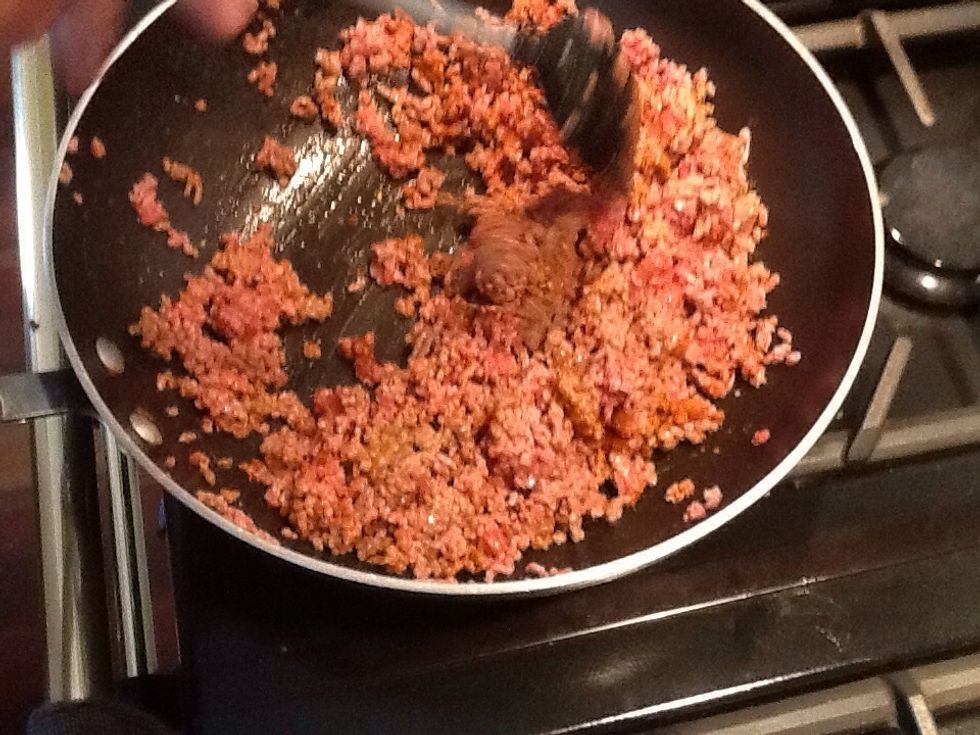 Cook the low-fat mince in a frying pan until the meat turns brown. Add spice mix. Make sure you are turning the meat at all times and breaking up meat as you stir.