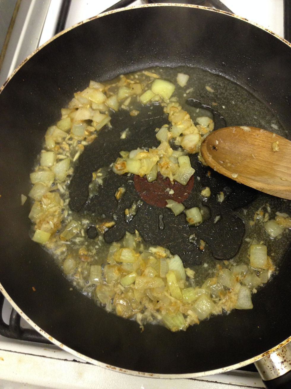 cook the onion and garlic until lightly browned. Add water to avoid stickiness