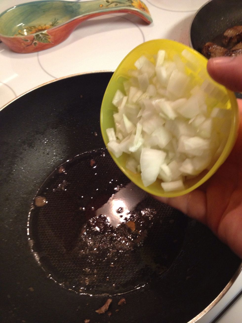 Cook the onion first on the same pan and add a bit of olive oil