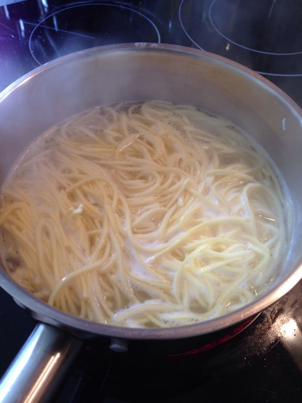 Cook the pasta. For the fresh one it should roughly take 6 minutes, which you can use for whipping eggs.