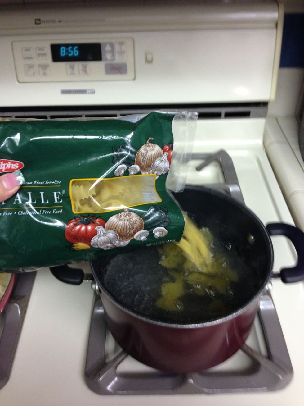 Cook the pasta. Usually I put linguine but I was out so I used farfalle.